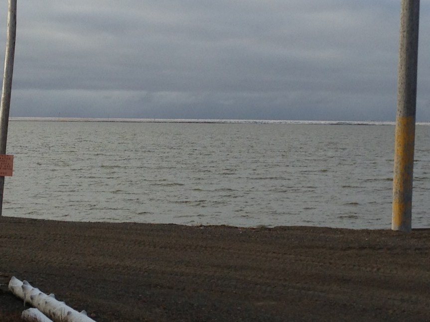 Snow on the tundra, seen across Middle Salt Lagoon.