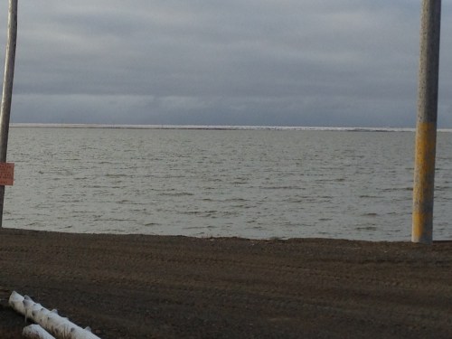 Snow on the tundra, seen across Middle Salt Lagoon.
