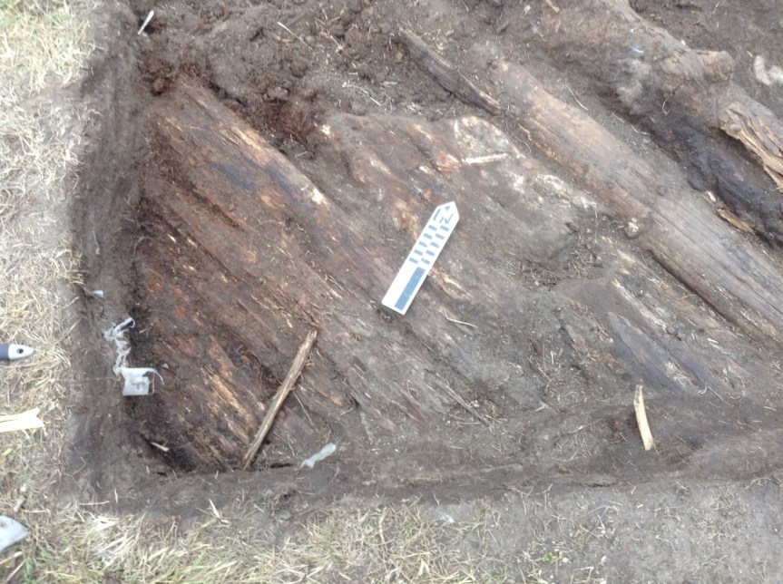 Probable tent floor after cleaning.  Pot was located in the lower left corner, left of the stick.  The oil patch surrounds the North arrow.