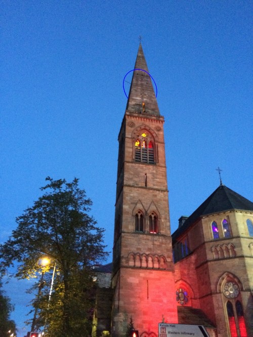 Òran Mór from the outside, with a blue halo on the tower.
